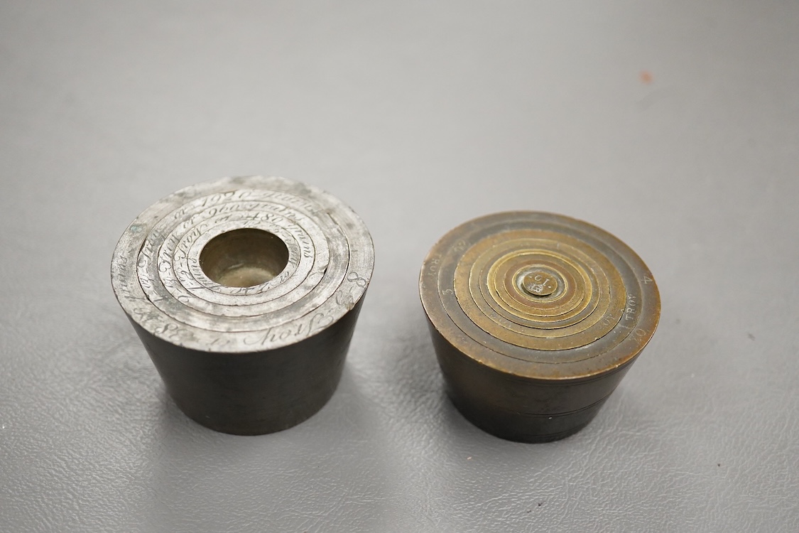 Two sets of bronze Troy nesting weights, one incomplete, with engraved rims, largest 8oz